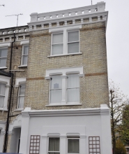 Front facade brick and stone repairs, and brick cleaning (after repair) Front facade brick and stone repair, and brick cleaning - after