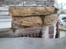 Damages to stone parapet Damages to stone parapet