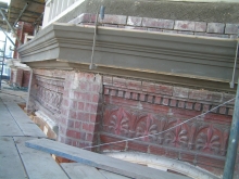 Final stage of the balcony cornice restoration Final stage of the stone balcony cornice restoration
