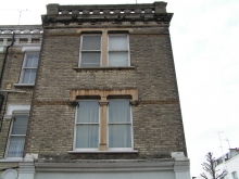 Front facade brick and stone repair, and brick cleaning - before