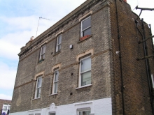 Side facade brick and stone repair, and brick cleaning - before