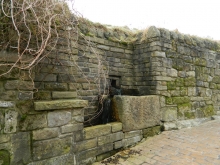 Wall embedded stone trough